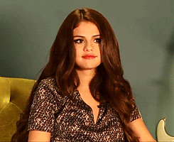 Selena Gomez shrugging GIF