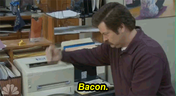 Ron Swanson animated Gif. "Bacon." Hi hits the top of his printer and the front opens to display hidden bacon.