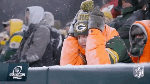 Defeated fan sitting in the snow
