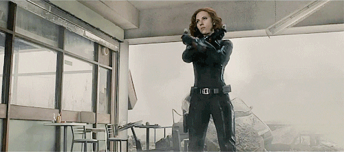 GIF of Black Widow (Scarlett Johansson) crossing and uncrossing her arms to unshield her batons