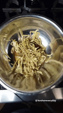 Draining the eggplant noodles