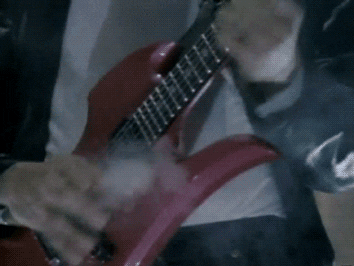 A guitar smokes from the guitarist's awesome playing