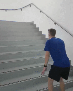 man jumping up stairs