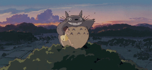 Totoro jumping out the top of a tree