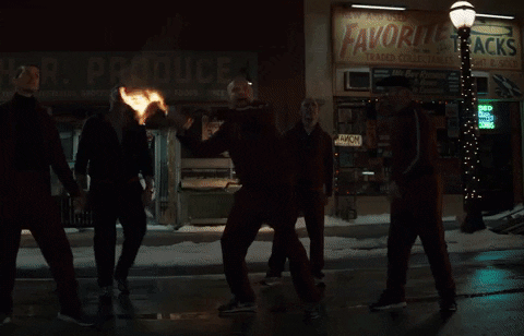 Guy in a red tracksuit throws a molotov cocktail through the window. Clint (Jeremy Renner) catches the molotov cocktail like a freaking legend, and throws it back