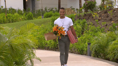 A man carrying a bouquet of flowers