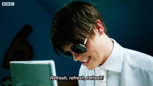 Man with longer hair and aviator sunglasses on laptop aggressively hitting the refresh button with the text "refresh, refresh, refresh"