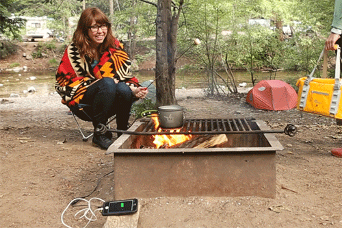 woman cooking in a firepit