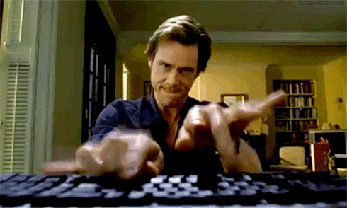 Jim Carrey typing aggressively on a keyboard