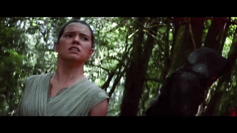 Rey reacts as Kylo points his lightsaber at her Rey reacts as Kylo points his lightsaber at her