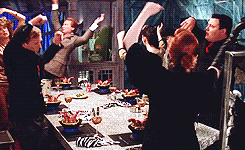 People dancing around food

Dinner Party Dancing GIF
https://media.giphy.com/media/u7rT5t9OkLiyQ/giphy.gif
