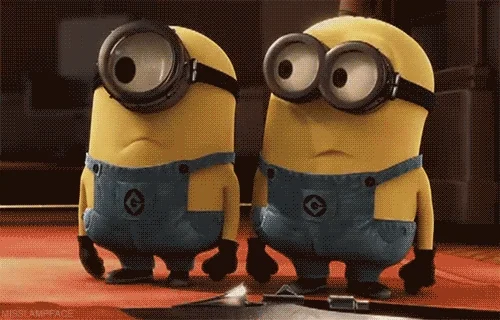 Two Minions salute