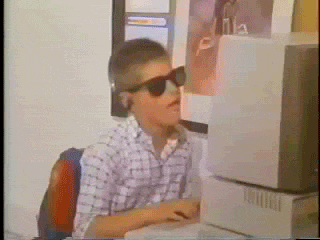 Boy dancing and pressing computer