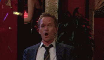 Gif of a TV show character clapping with confetti falling