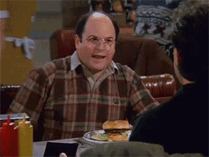 George, da série Seinfeld, mostrando sua carteira cheia de dinheiro