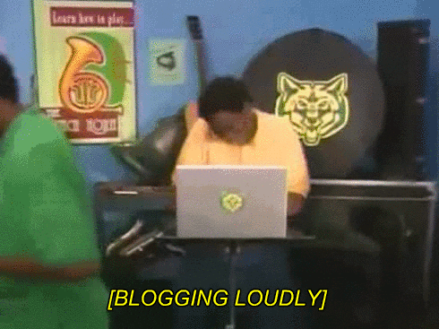 A boy dances as he types on his laptop, captioned "[BLOGGING LOUDLY]"