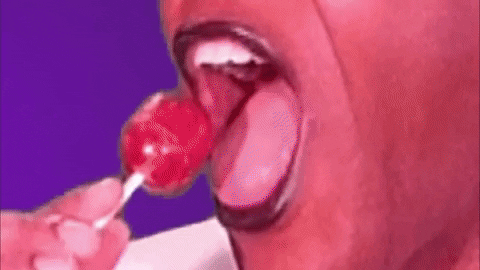 A person sucking on a lollipop