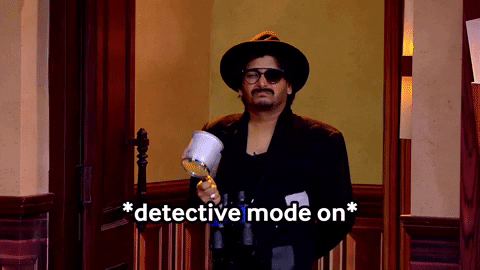 A man dressed as a quirky detective