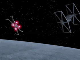 Two tie fighter spaceships race each other through space.
