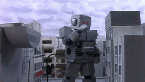 Gif of a giant dancing robot in a city, taken from the music video Intergalactic by the Beastie Boys