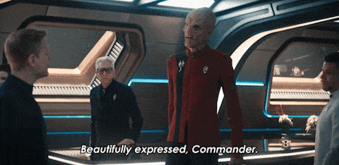 Commander being complimented by Alien