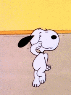 Snoopy from Peanuts dances happily.