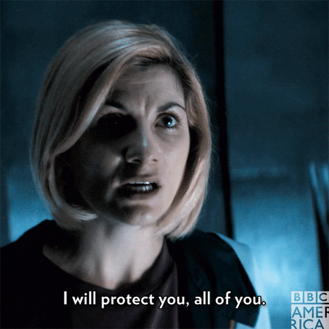 The 13th Doctor from Doctor Who looks into the camera. She says, "I will protect you, all of you."