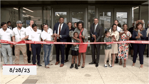 A GIF showing Mayor Bowser and city leaders cutting the ribbon at Raymond Elementary School.