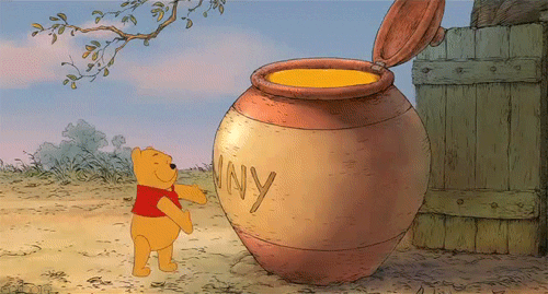 Winnie the Pooh hugs a giant pot of honey that's taller than he is.