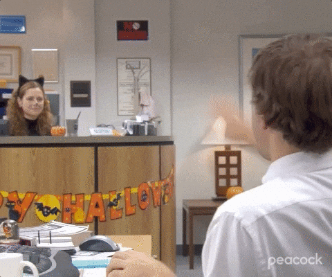 Jim and Pam from the Office high fiving