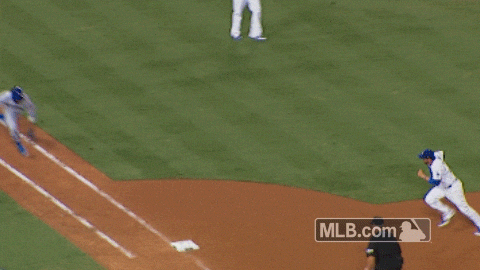 Baseball umpire calling a runner safe