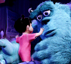 A gif from the movie Monsters, Inc. A little girl in a pink dress hugs a large furry blue monster, who looks a little wistful.