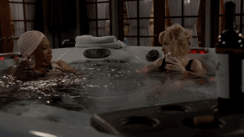 Two women sitting in a jacuzzi