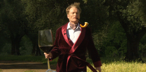 Man holding a huge glass of wine