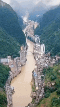 City on banks of river in wow gifs