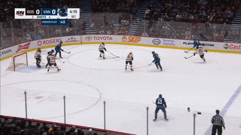 Young hockey goalie performs a moonwalk during a break in the action