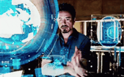 Tony Stark working with holographic displays in the lab