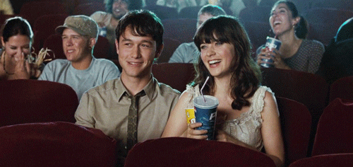 Valentine's Day gif. A scene where the couple are watching a movie in the theatre.