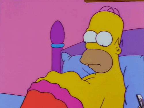 Homor from the Simpsons laying in bed, his belly visibly rumbling with hunger.