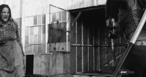 A woman covered in blood running forward. A woman covered in blood running forward.