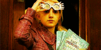 Luna holding glasses on her head and The Quibbler