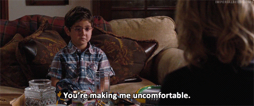 A gif from 'Bridesmaids'. A child is sitting on a couch, saying 'You're making me uncomfortable.'