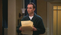 Gif of a man throwing a pile of papers into the air.