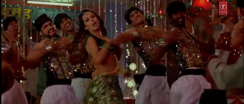 [Image description: The actress Malaika Arora and five male dancers dancing to the song Munni Badnaam.]