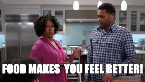[Gif description: A woman telling a man "food makes you feel better"] via Giphy