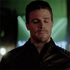 Oliver Queen with bittersweet facial expression gif