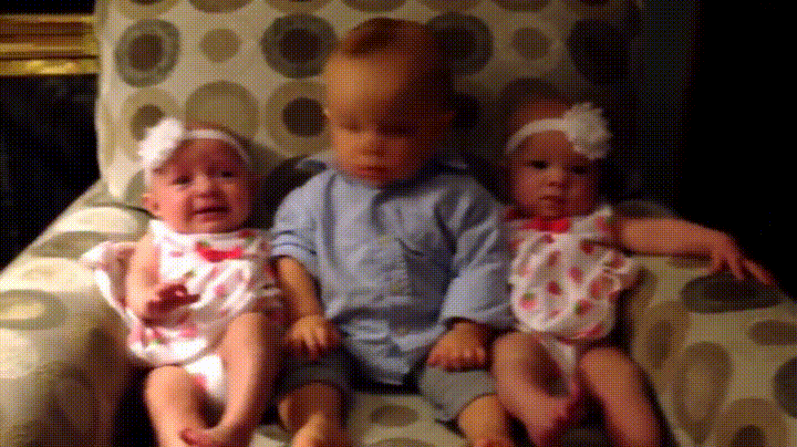 Kids on a couch, baby between twins_gif