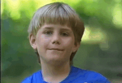Gif of boy in blue shirt confused.