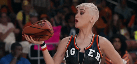 katy perry blowing on a basketball to magically inflate it