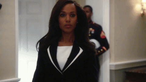 Kerry Wahsington of Scandal in power suit walking with self-confidence